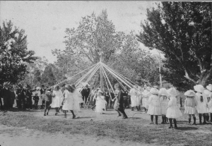 Students dancing around the maypole.